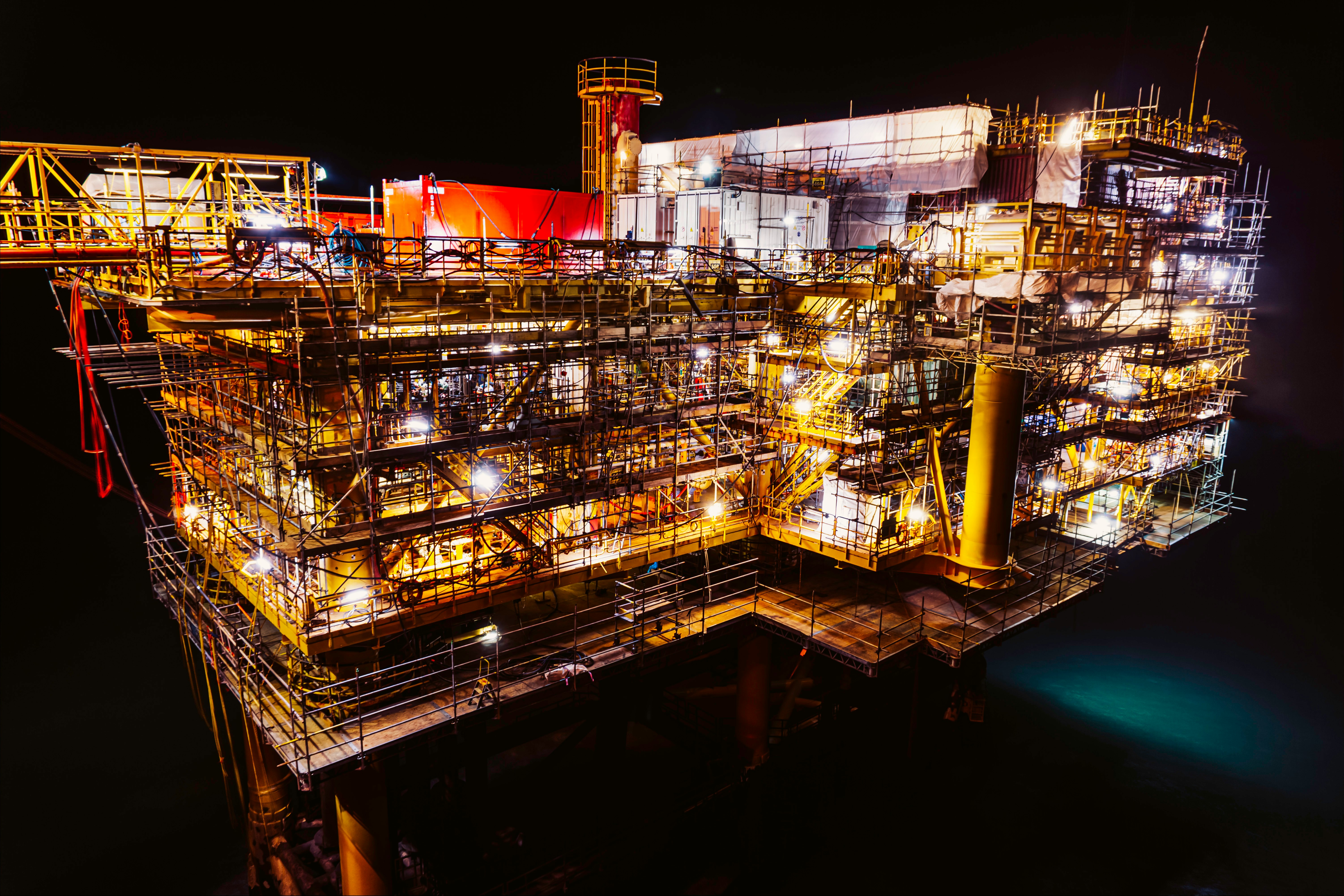 Offshore energy platform lit at night